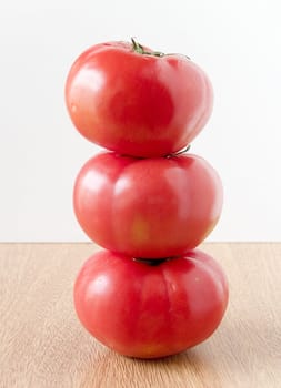 three tomatoes stacked