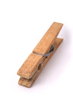 Old wooden clip on white background.