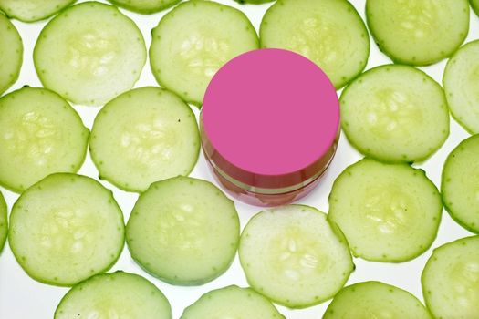 Moisturizing cucumber day cream  surrounded with cucumber slices
