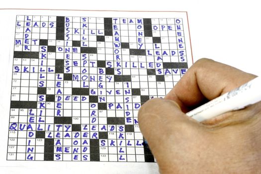 working on a crossword puzzle with highlights on skills and teamworks