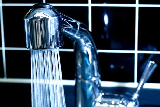 Modern Faucet in Monochrome Color with running Water