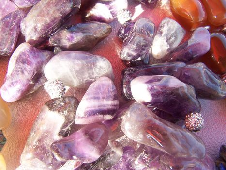 Preetty amethyst and silver beads. Close up.