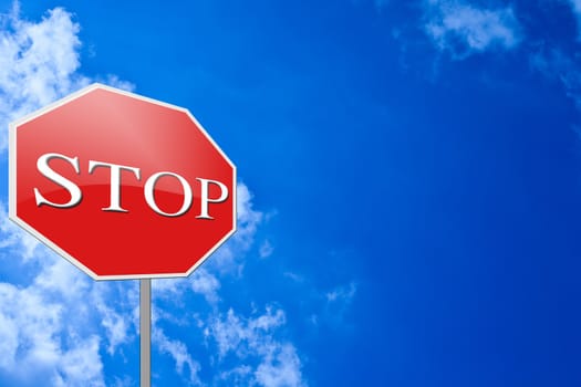 Red stop sign on blue sky background