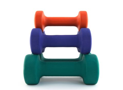 yramid made of colorful dumbbells. White background.