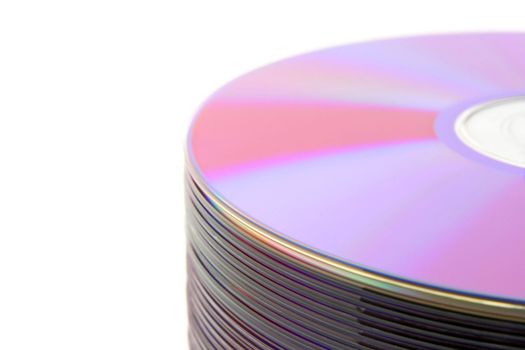 Close-up of stacked purple DVDs or CDs on white background.