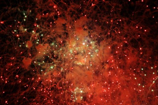 Abstract colorful fireworks lights resembling galaxy stars.