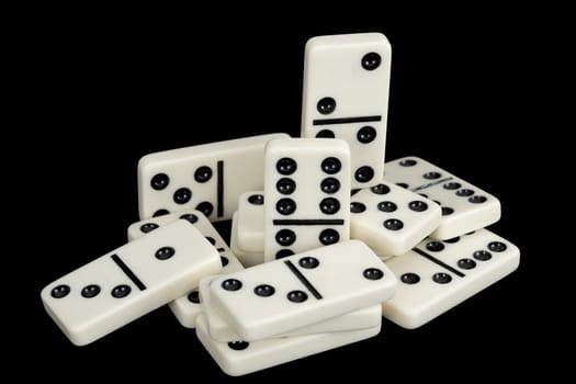A bunch of dominoes isolated on a black background