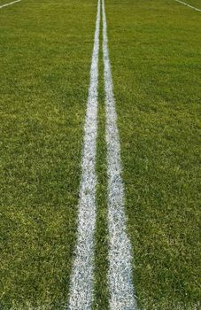 Boundary lines of a green playing field.