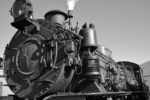 an old steam train in black in white