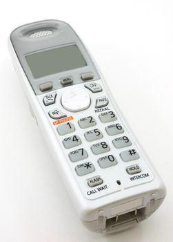 White portable home digital phone, angled shot 