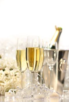 Glasses of champagne for a wedding reception on white background