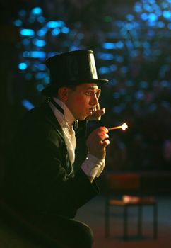 The clown makes a trick with fire