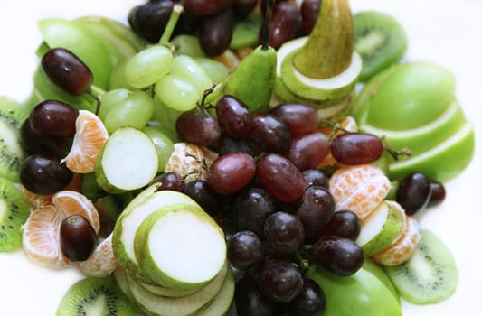 Sliced fresh fruits studio isolated
