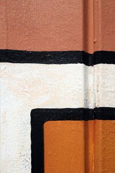 Detail of abstract painting on a wall. Black lines and colors.