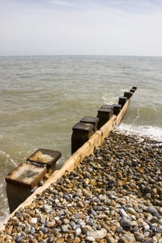 Groyne leading into the sea on a cold day