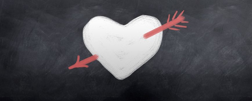 A red arrow is shot through a white heart. Written in chalk on a blackboard