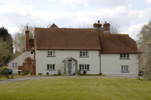 A large white house in the countryside