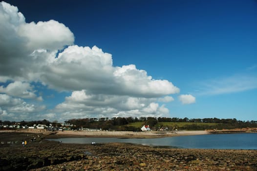 sully island with water, blues sky and white cloud