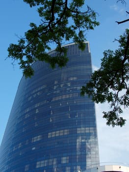 A skyscraper made of glass and concrete