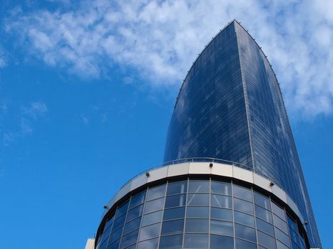 A skyscraper made of glass and concrete