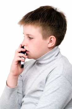 little boy with mobile phone on a white background