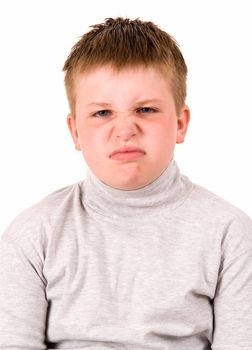 angry little boy on a white background