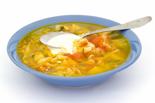 Plate with soup on a white background