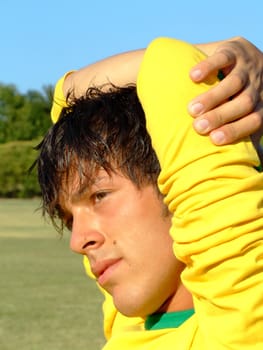 Portrait of a twenty years old boy dressed in yellow