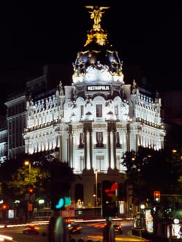 Night traffic in the avenue in front of Metropolis palace
