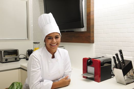 Portrait of a happy chef  cooking in kitchen