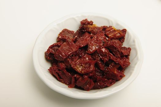dried tomatoes in white dish