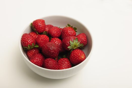 organic straberries in white dish