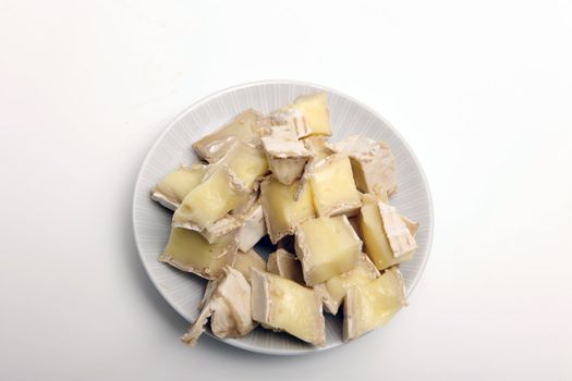 brie cheese in white dish