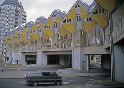 Van driving under the Rotterdam Cube Houses.