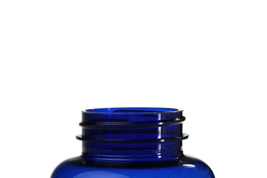 Open dark blue plastic bottle for medicines on a white background.