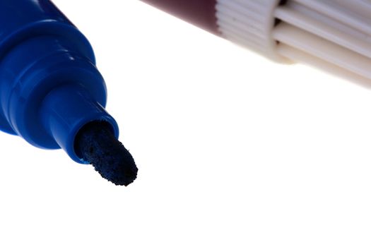Open dark blue felt-tip pen for work at office or design works on a white background.