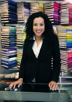 small business: happy owner of a fabric store