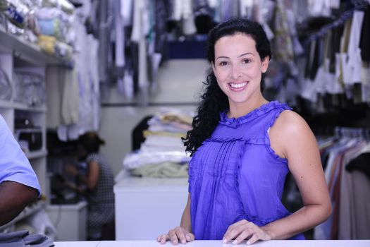 small business: happy owner of a dry cleaning service
