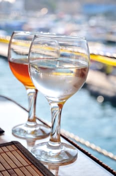 two glasses  with cold water and cold juice on the table in the water restaurant 