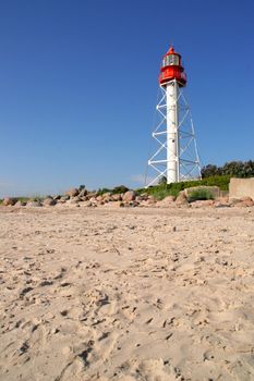 footprinted beach sand by the white lighhouse, Rucava, Latvia