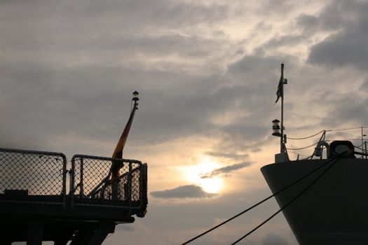 two ships silhouettes in sunset