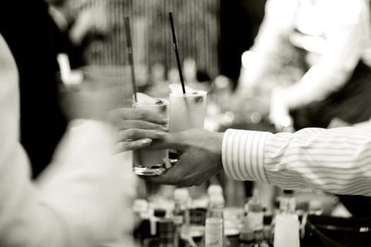 bartender serves a drinks, natural light, high ISO