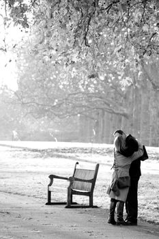 hugs and kisses, middle age couple, Saint James park, London