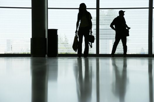 delayed flight, people with luggage