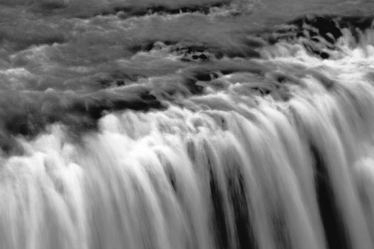 waterfall located on the White River in south central Iceland, motion blurred oil painting effect