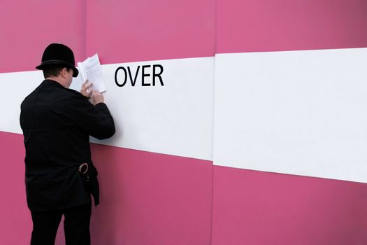 punishment scene by the pink wall, London, UK