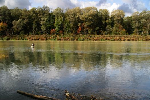 fly fishing in autumn river