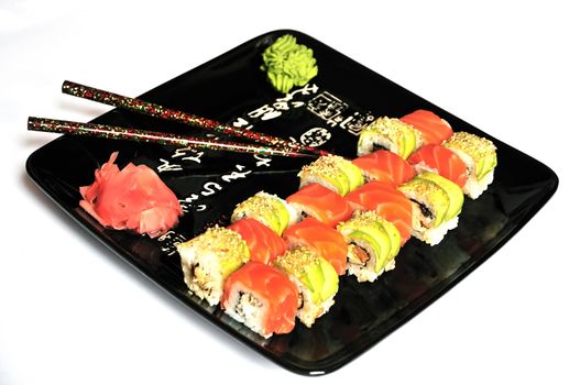 sushi maki on the plate over white background