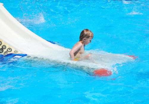 boy is already in the end of water slide
