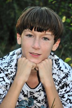freckled teenage boy looking at the camera